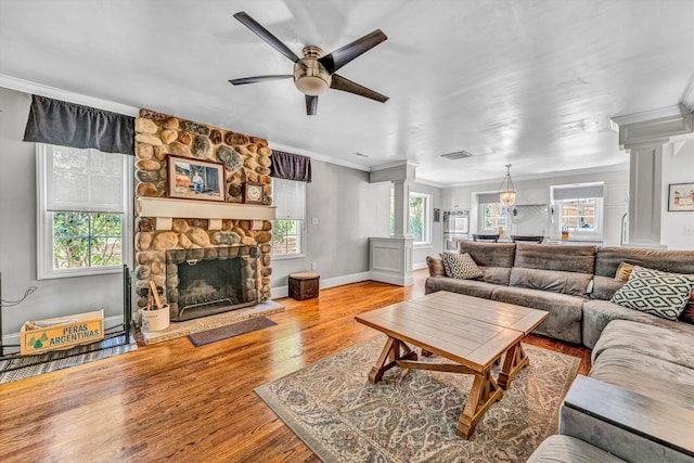 2410 Cornwallis Ave SE, Roanoke, VA 24014 - living room with decorative columns, plenty of natural light, a ceiling fan, ornamental molding, and wood finished floors