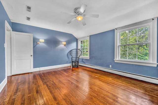 2410 Cornwallis Ave SE, Roanoke, VA 24014 - spare room with lofted ceiling, baseboard heating, wood finished floors, and a ceiling fan