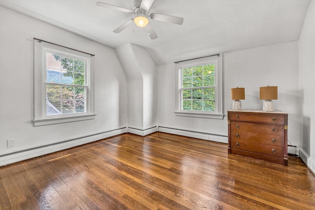 2410 Cornwallis Ave SE, Roanoke, VA 24014 - unfurnished bedroom featuring hardwood / wood-style flooring, a baseboard heating unit, vaulted ceiling, multiple windows, and a ceiling fan