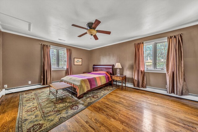 2410 Cornwallis Ave SE, Roanoke, VA 24014 - bedroom featuring attic access, wood finished floors, ornamental molding, a ceiling fan, and baseboard heating