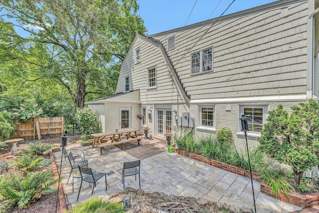 2410 Cornwallis Ave SE, Roanoke, VA 24014 - rear view of house featuring a gambrel roof, french doors, and a patio area