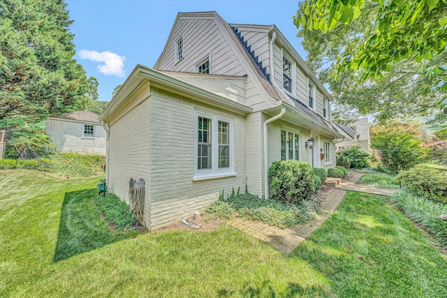2410 Cornwallis Ave SE, Roanoke, VA 24014 - view of side of home with a lawn and brick siding