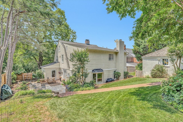 2410 Cornwallis Ave SE, Roanoke, VA 24014 - back of property featuring a chimney and a patio area
