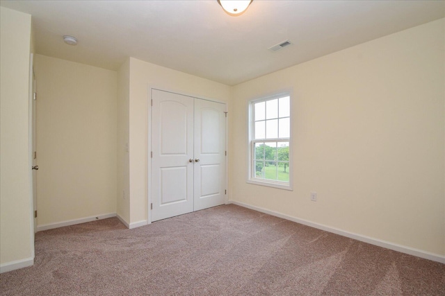 8322 Leighburn Dr, Roanoke, VA 24019 - unfurnished bedroom featuring carpet floors and a closet