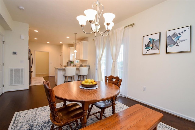 8322 Leighburn Dr, Roanoke, VA 24019 - dining space with dark wood-style floors, a chandelier, and recessed lighting