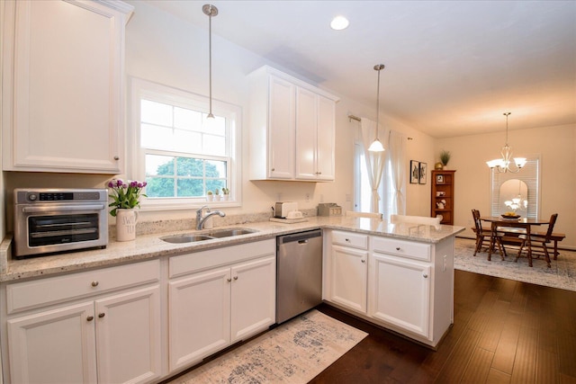 8322 Leighburn Dr, Roanoke, VA 24019 - kitchen with stainless steel dishwasher, a peninsula, white cabinets, dark wood finished floors, and a chandelier