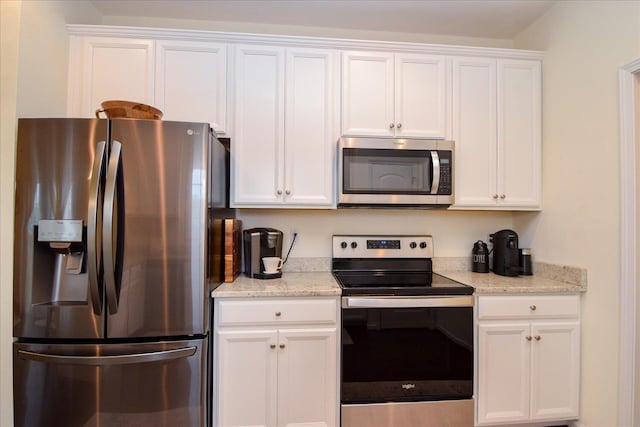 8322 Leighburn Dr, Roanoke, VA 24019 - kitchen with stainless steel appliances, white cabinets, and light stone counters