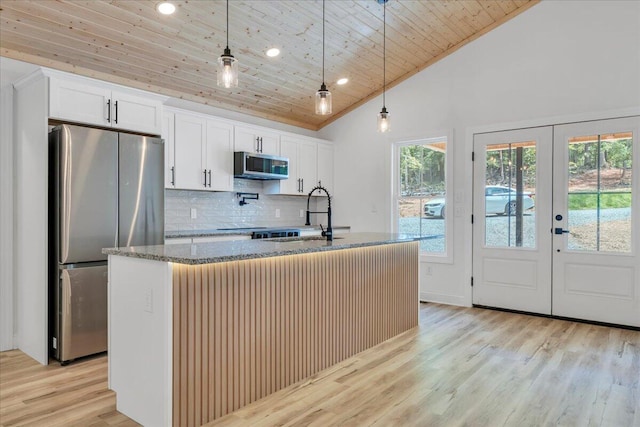 2365 Lakewood Forest Rd, Moneta, VA 24121 - kitchen with appliances with stainless steel finishes, wood ceiling, tasteful backsplash, light stone countertops, and an island with sink