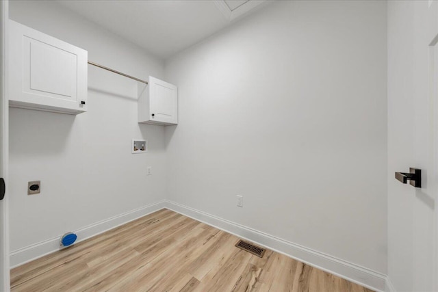 2365 Lakewood Forest Rd, Moneta, VA 24121 - laundry area featuring cabinet space, hookup for a washing machine, light wood-style flooring, and electric dryer hookup