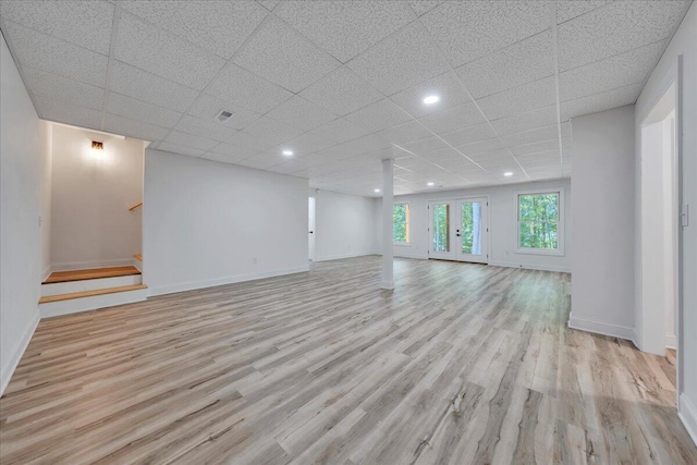 2365 Lakewood Forest Rd, Moneta, VA 24121 - unfurnished living room featuring light wood finished floors, a drop ceiling, stairway, and recessed lighting