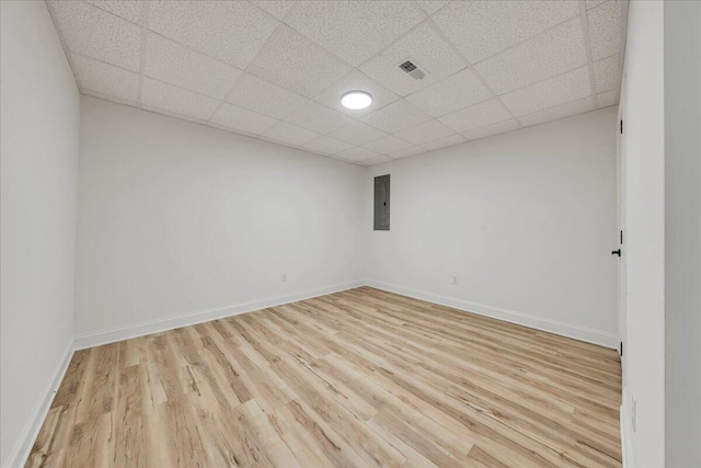 2365 Lakewood Forest Rd, Moneta, VA 24121 - unfurnished room featuring electric panel, light wood-style flooring, and a drop ceiling