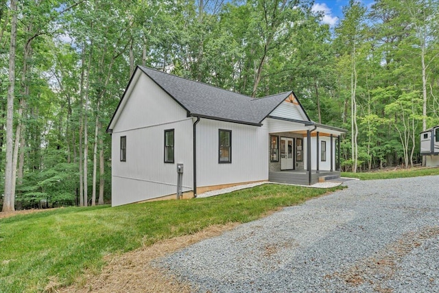 2365 Lakewood Forest Rd, Moneta, VA 24121 - view of front of house featuring covered porch, driveway, a front yard, and a shingled roof