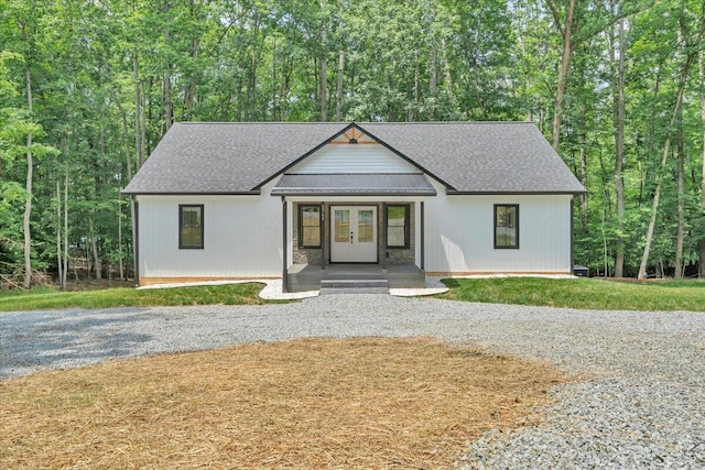 2365 Lakewood Forest Rd, Moneta, VA 24121 - view of front of property featuring french doors, roof with shingles, driveway, and a view of trees