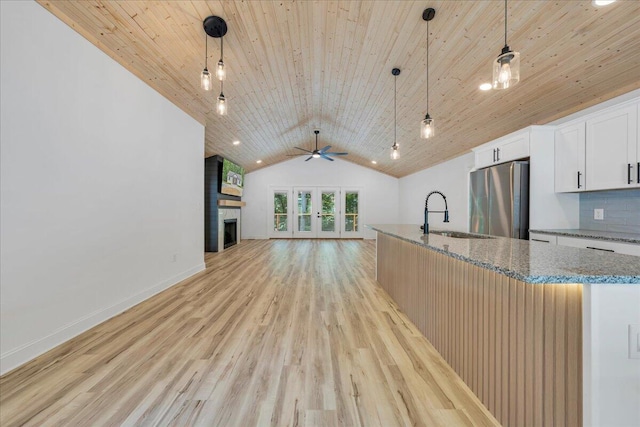 2365 Lakewood Forest Rd, Moneta, VA 24121 - kitchen with freestanding refrigerator, wooden ceiling, vaulted ceiling, light wood finished floors, and ceiling fan