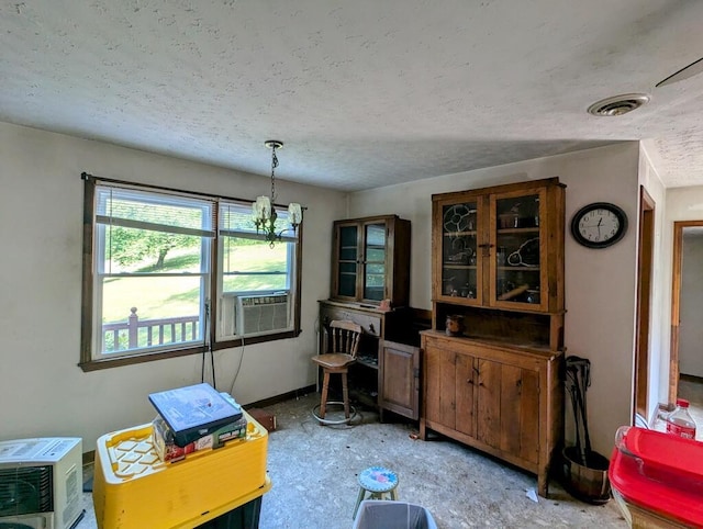 606 Haycock Rd SE, Floyd, VA 24091 - dining area with a textured ceiling, a chandelier, and cooling unit