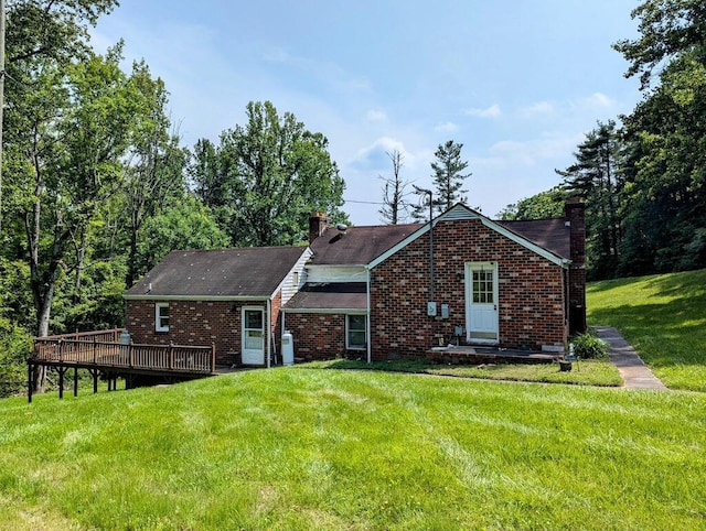 606 Haycock Rd SE, Floyd, VA 24091 - view of front of home with a chimney, a front lawn, a wooden deck, and brick siding