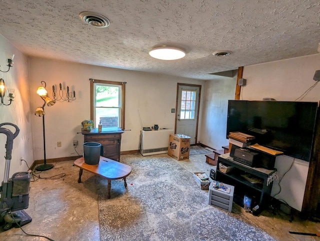 606 Haycock Rd SE, Floyd, VA 24091 - living room with a textured ceiling and baseboards