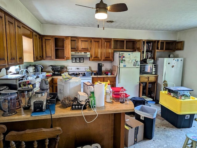 606 Haycock Rd SE, Floyd, VA 24091 - kitchen with white appliances, open shelves, under cabinet range hood, ceiling fan, and brown cabinets
