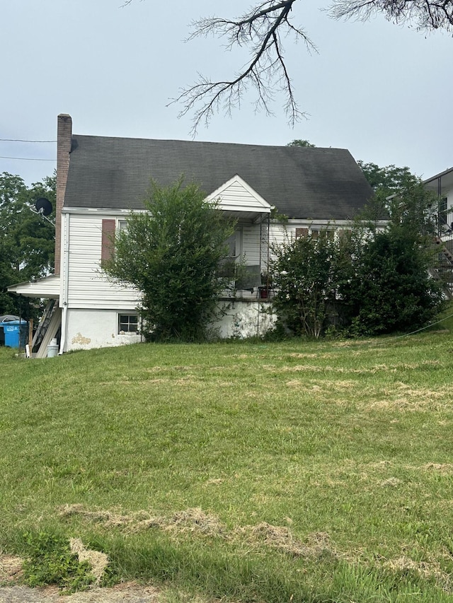 1622 Wayne St NE, Roanoke, VA 24012 - view of home's exterior featuring a lawn and a chimney
