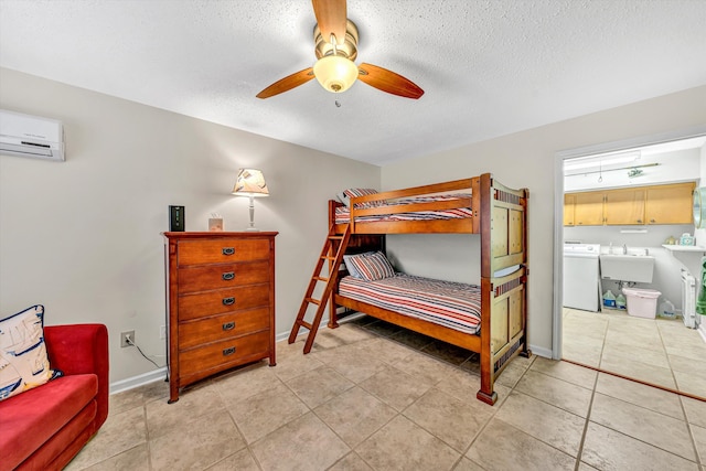 1230 Nature Ln Unit 1, Union Hall, VA 24176 - bedroom with washer / dryer, a wall mounted air conditioner, a textured ceiling, light tile patterned flooring, and connected bathroom