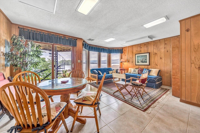 1230 Nature Ln Unit 1, Union Hall, VA 24176 - dining area featuring wooden walls, a textured ceiling, and light tile patterned floors
