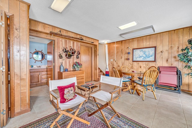 1230 Nature Ln Unit 1, Union Hall, VA 24176 - living area featuring wooden walls, light tile patterned floors, and a textured ceiling