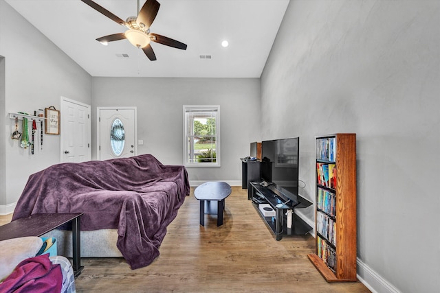 2027 Clinton Ave SE, Roanoke, VA 24013 - living room featuring wood finished floors, ceiling fan, recessed lighting, and a high ceiling