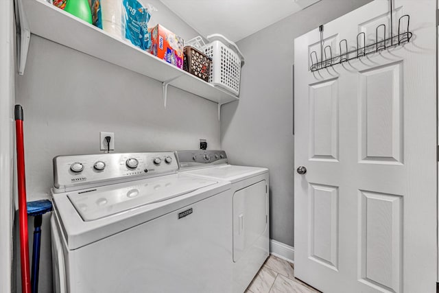2027 Clinton Ave SE, Roanoke, VA 24013 - washroom with washing machine and dryer and light marble finish flooring