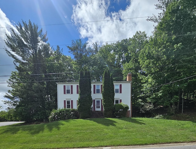 2633 Wood Warbler Ln, Roanoke, VA 24018 - colonial home with a chimney and a front lawn
