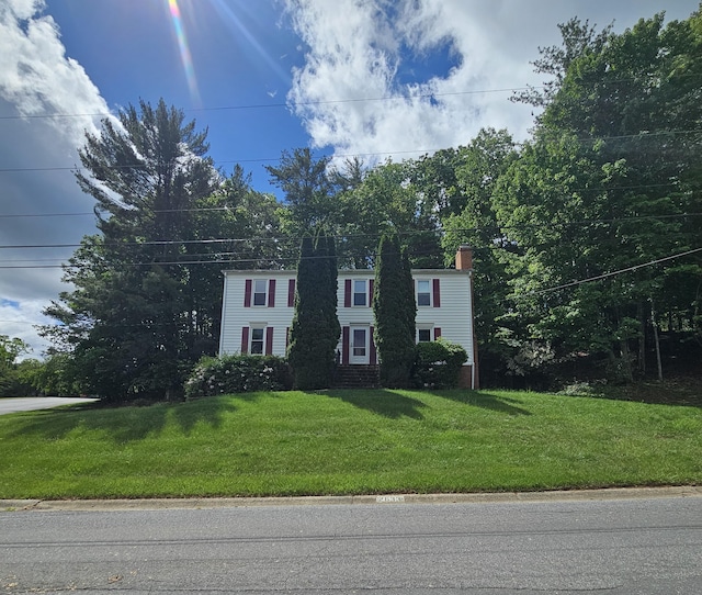 2633 Wood Warbler Ln, Roanoke, VA 24018 - colonial-style house with a chimney and a front lawn