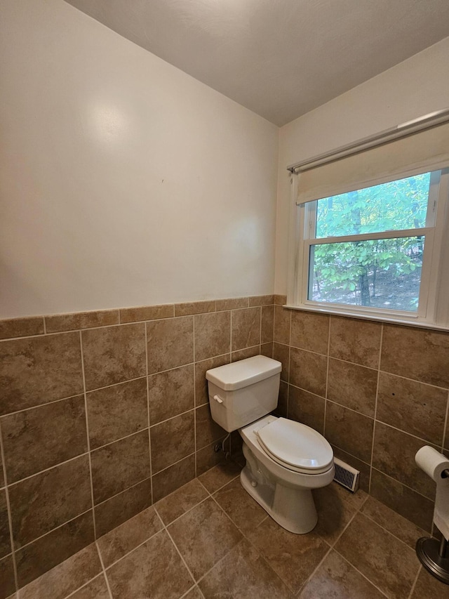 2633 Wood Warbler Ln, Roanoke, VA 24018 - half bath with tile walls, wainscoting, and tile patterned flooring
