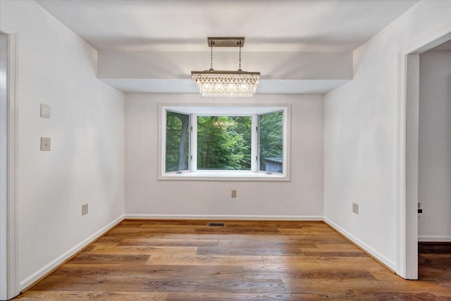 112 Sedgefield Ln, Vinton, VA 24179 - spare room featuring a chandelier and wood finished floors