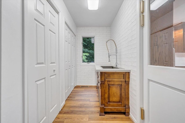 112 Sedgefield Ln, Vinton, VA 24179 - bar featuring light wood finished floors and brick wall