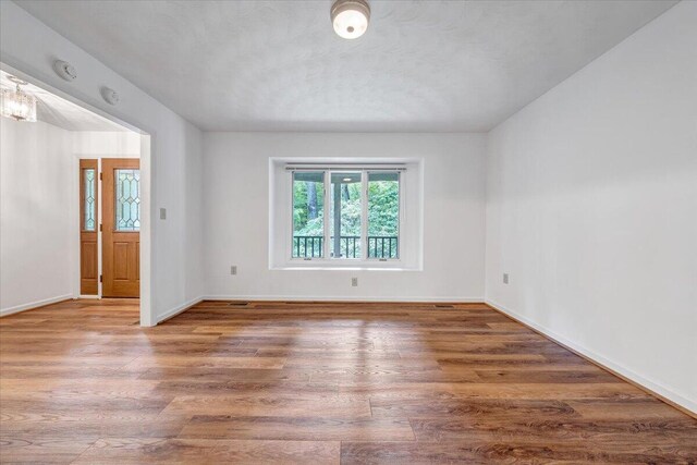 112 Sedgefield Ln, Vinton, VA 24179 - spare room featuring wood finished floors and a smoke detector