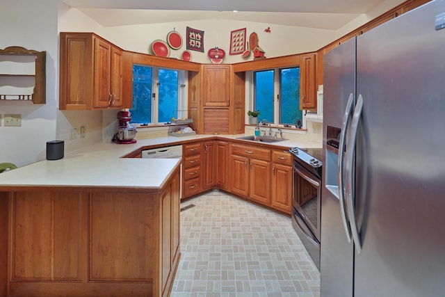126 Windmere Trl, Moneta, VA 24121 - kitchen featuring appliances with stainless steel finishes, a peninsula, lofted ceiling, light countertops, and brown cabinets