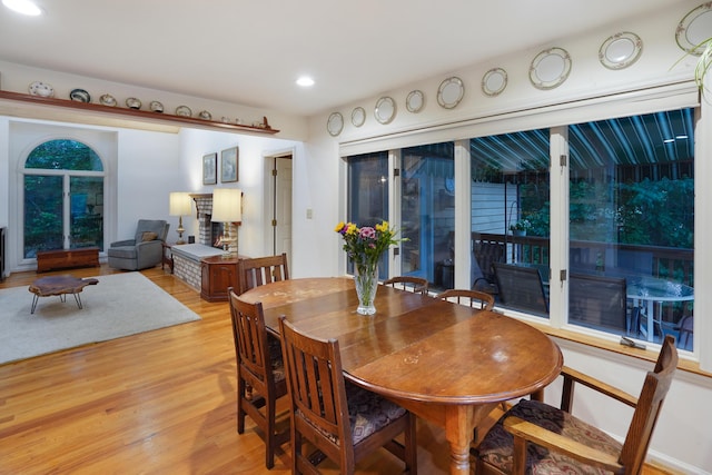 126 Windmere Trl, Moneta, VA 24121 - dining space featuring a fireplace, light wood-style floors, and recessed lighting