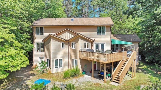 126 Windmere Trl, Moneta, VA 24121 - back of property with a deck, stairs, and view of scattered trees