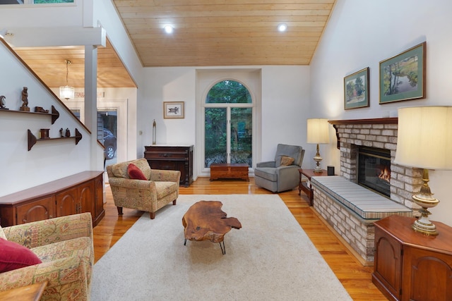 126 Windmere Trl, Moneta, VA 24121 - living room with wood ceiling, a glass covered fireplace, light wood finished floors, and lofted ceiling