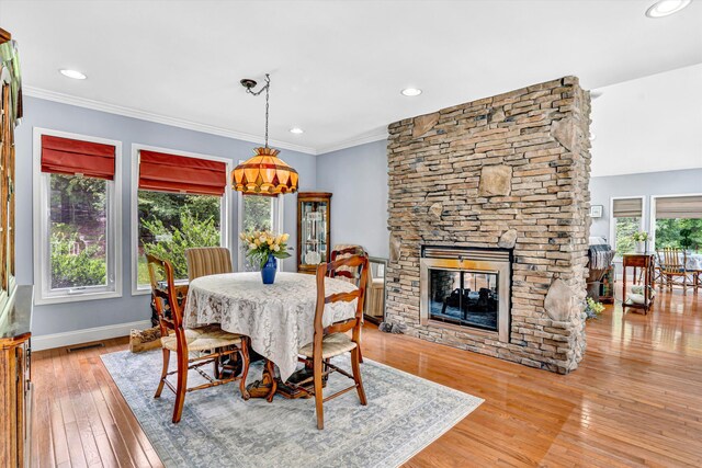 304 Blazing Ridge Dr Unit 0, Pittsville, VA 24139 - dining area featuring wood-type flooring, ornamental molding, recessed lighting, and a stone fireplace