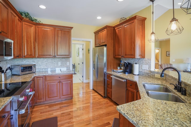 414 Augusta Way, Wirtz, VA 24184 - kitchen with stainless steel appliances, light wood-style floors, hanging light fixtures, light stone countertops, and backsplash