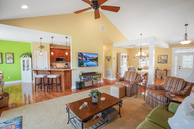 414 Augusta Way, Wirtz, VA 24184 - living area featuring a chandelier, ceiling fan, light wood-type flooring, high vaulted ceiling, and recessed lighting