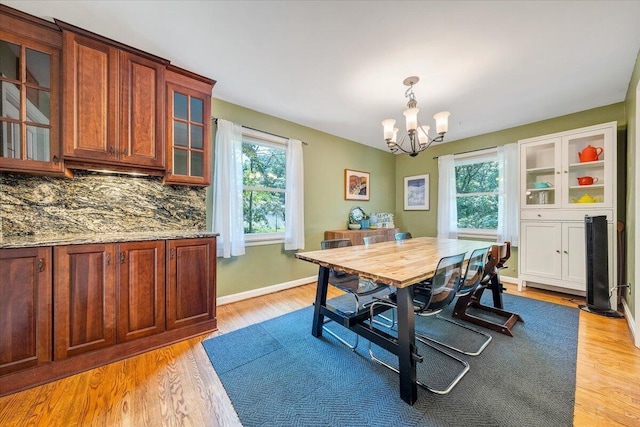 2702 Yellow Mountain Rd SE, Roanoke, VA 24014 - dining room with a chandelier and light wood-style floors