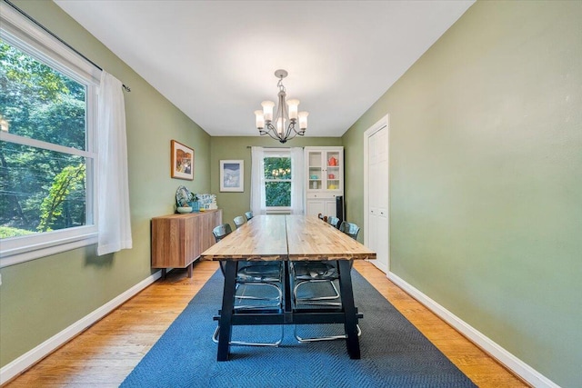 2702 Yellow Mountain Rd SE, Roanoke, VA 24014 - dining space featuring light wood-style flooring and a chandelier