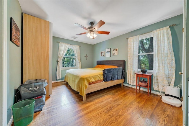 2702 Yellow Mountain Rd SE, Roanoke, VA 24014 - bedroom featuring light wood-style flooring and ceiling fan