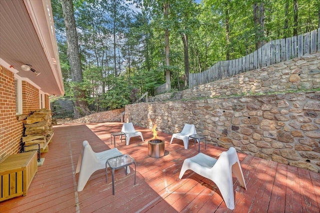 2702 Yellow Mountain Rd SE, Roanoke, VA 24014 - wooden terrace with a fire pit and a fenced backyard