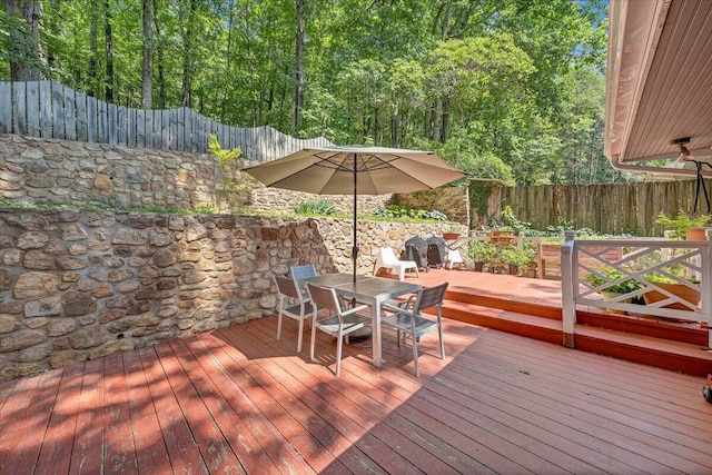 2702 Yellow Mountain Rd SE, Roanoke, VA 24014 - deck with outdoor dining space and a fenced backyard
