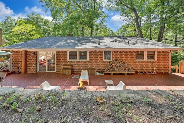 2702 Yellow Mountain Rd SE, Roanoke, VA 24014 - rear view of house with a deck, brick siding, and roof with shingles