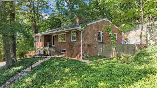 2702 Yellow Mountain Rd SE, Roanoke, VA 24014 - view of side of home with brick siding and a chimney