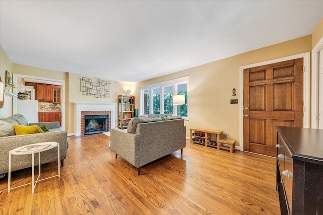 2702 Yellow Mountain Rd SE, Roanoke, VA 24014 - living area with light wood-type flooring and a fireplace