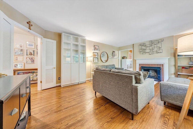 2702 Yellow Mountain Rd SE, Roanoke, VA 24014 - living room with light wood-style flooring and a fireplace